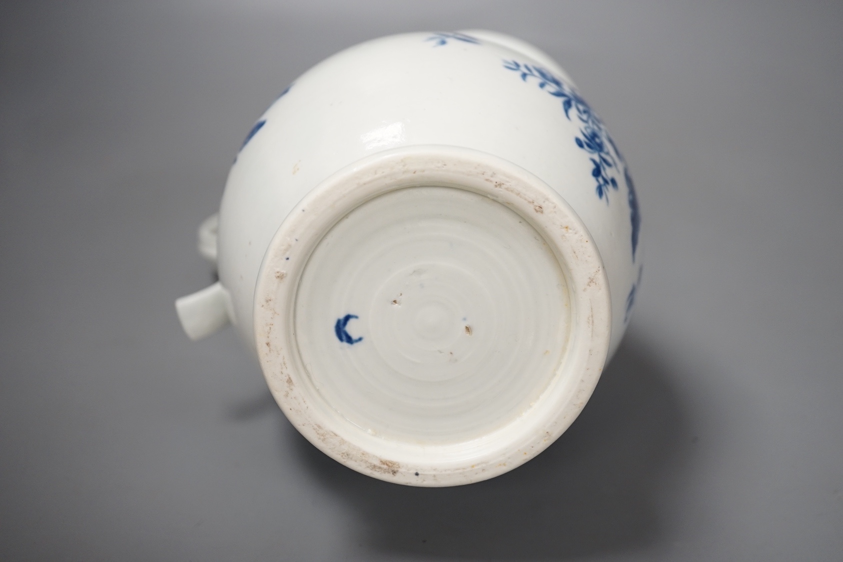 A Worcester French style water ewer decorated in under-glaze blue with fir cones and rose hips c. 1775, 21cm